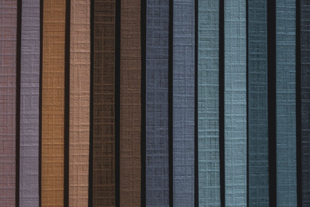 Detail of geltex clothbound paper sampler with goffered canvas-like texture and a palette of cyan, blue and brown coloursの写真素材