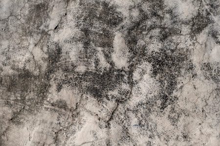 Detail of old cracked wall plaster with damp stains, grunge textureの写真素材