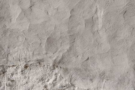 Detail of white lime washed wall plaster textureの写真素材