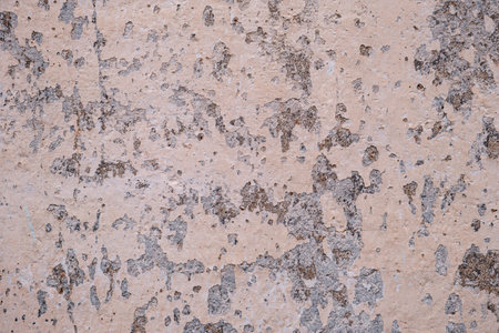 Detail of old painted wall with scraps of flaking paint, grunge backgroundの写真素材