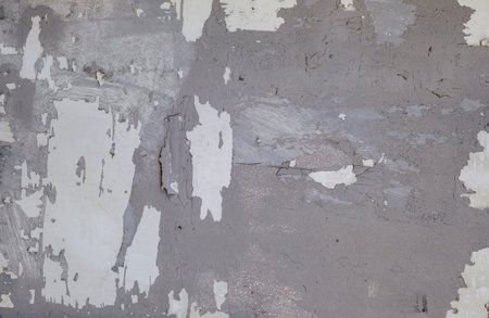 Detail of old wall with scraps of flacking plaster, grunge textureの写真素材