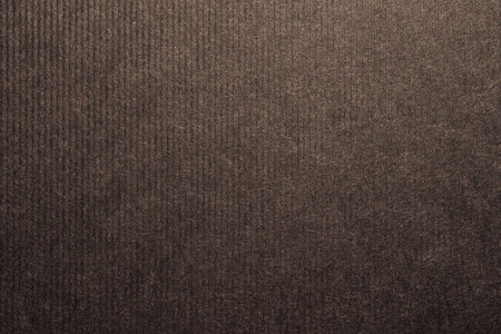 Chocolate brown colored ribbed craft paper, handmade artisan paper textureの写真素材