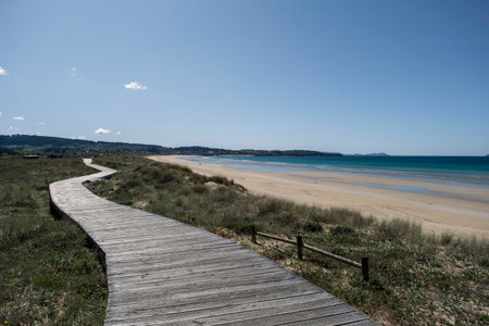 Wooden walkway on the dunes of A Lanzada Beach in Galicia, Spainの写真素材