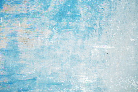 Old worn out blue painted corroded metal sheet grunge backgroundの写真素材
