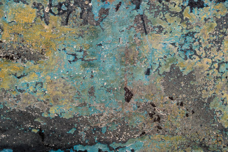 Detail of old wall texture with scraps of flaking paint layers, grunge backgroundの写真素材