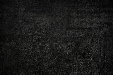 Detail of black scraped wall texture grunge backgroundの写真素材