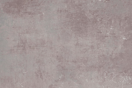 Pale rose colored scraped metal sheet grunge backgroundの写真素材