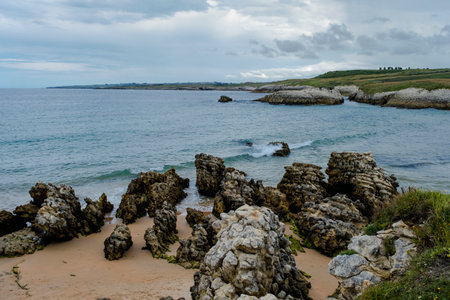 Rocky beach in Playa Virgen del Mar, Costa Quebrada, Cantabria, Spainの写真素材
