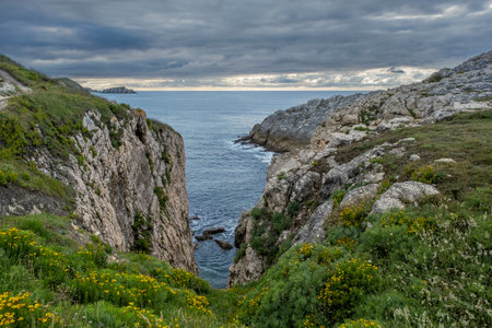 Steep cliffs in the island of Virgen del Mar, Costa Quebrada, Cantabria, Spainの写真素材