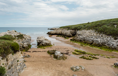 Rocky beach Playa Virgen del Mar, Costa Quebrada, Cantabria, Spainの写真素材