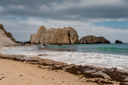 Sea stacks in the Arnia beach, also known as Playa de los Farallones. Costa Quebrada of Liencres, Broken Coast, Cantabria, Spainの写真素材