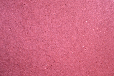 Detail of cerise coloured artisan paper textureの写真素材
