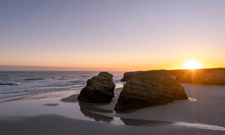 Sunrise in As Catedrais Beach, Lugo, Spainの写真素材
