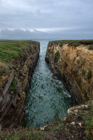 Sea canyon sculpted bt the sea in the cliffs of Ribadeo, Marina Lucense, Galicia, Spainの写真素材