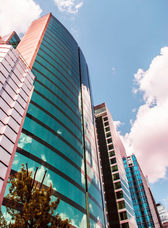 Directly below view of corporate buildings.