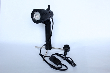 A black photographer's lamp on tripod for light boxの写真素材