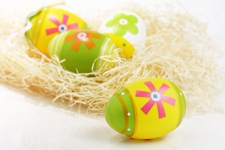 Painted Easter eggs in straw