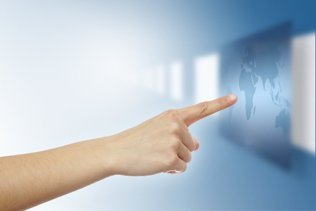 Pointer finger touching virtual world mapの写真素材