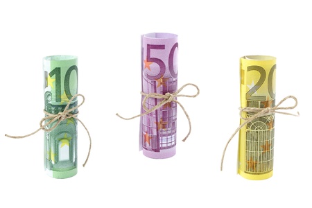 Rolled and tied Euro banknotes isolated on whiteの写真素材