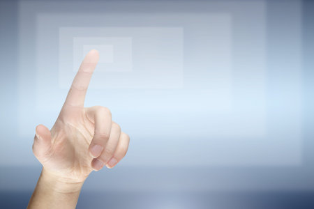 Female finger pressing virtual button の写真素材