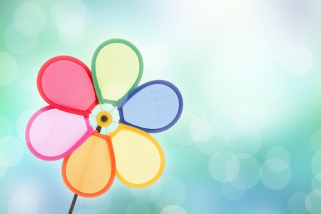 colorful pinwheel toy against bokeh backgroundの写真素材