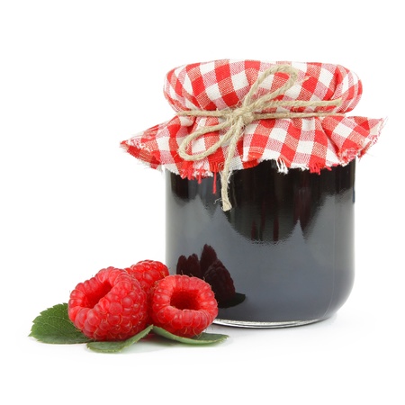 Jam in a jar with fresh raspberries, isolated on whiteの写真素材