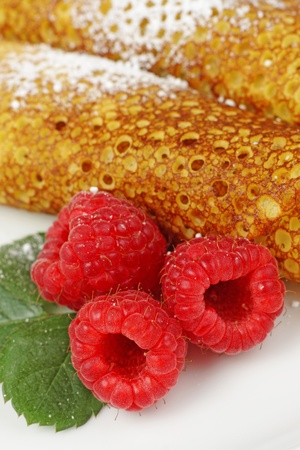 Pancakes with raspberries served on plateの写真素材