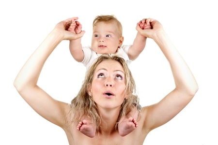 Young mother playing with her baby boy isolated on whiteの写真素材