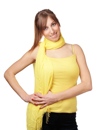 Cute young woman with yellow scarf isolated on whiteの写真素材