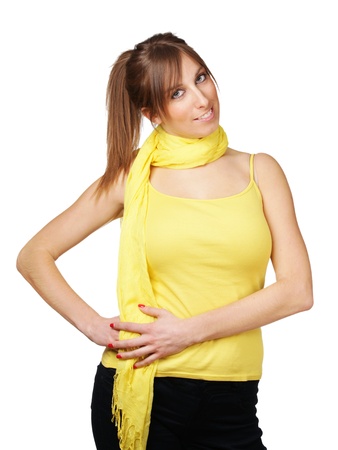 Cute young woman with yellow scarf isolated on whiteの写真素材