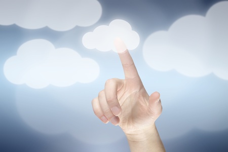 Cloud computing concept, finger touching the cloudの写真素材