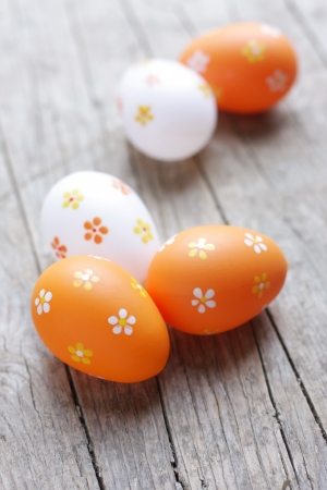 Painted easter eggs on wooden deskの写真素材