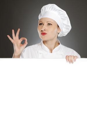 Female chef showing positive gesture with blank copy spaceの写真素材