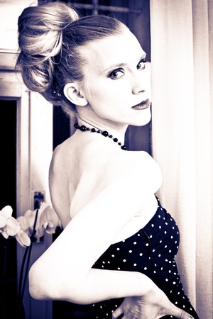 Attractive young woman posing in retro styleの写真素材