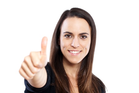 Smiling woman with thumbs up - isolated over a white background の写真素材