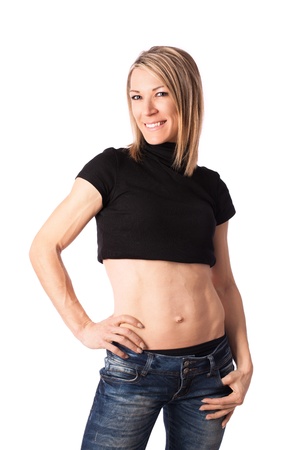 Young fit woman with toned body posing in studioの写真素材