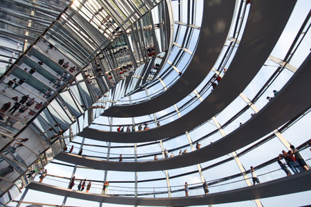 BERLIN, GERMANY - AUGUST 20: People visit the Reichstag dome at the German parliament August 20,...
