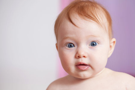 Cute ginger hair baby with blue eyes