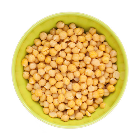 cooked and peeled chickpeas in green cupの写真素材