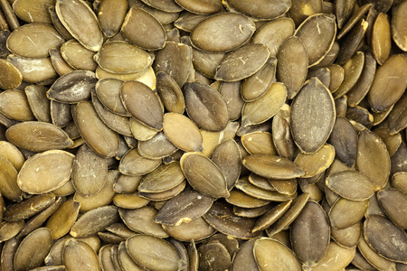 Pumpkin seeds - Textured background imageの写真素材