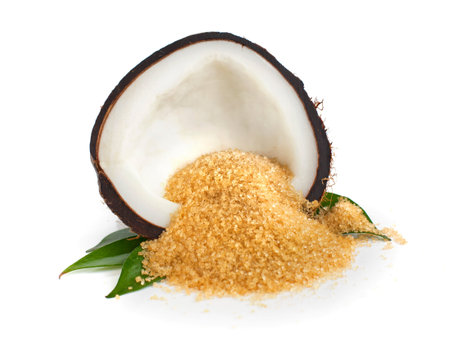 Coconut half and coconut sugar on whiteの写真素材