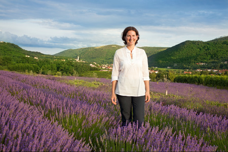 Woman in the middle of lavender fieldの写真素材