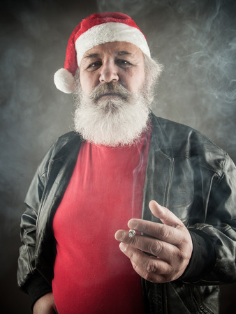 Grumpy badass Santa Claus with cigaretteの写真素材