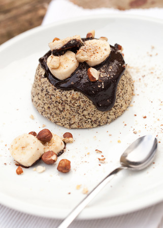 Healthy paleo mug cake with dark chocolate, banana and hazelnutsの写真素材