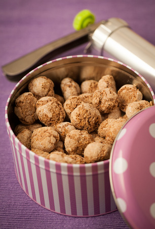 Home made coconut cookies in tin canの写真素材