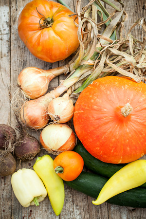 Home grown heatlhy vegetables on wooden boardの写真素材