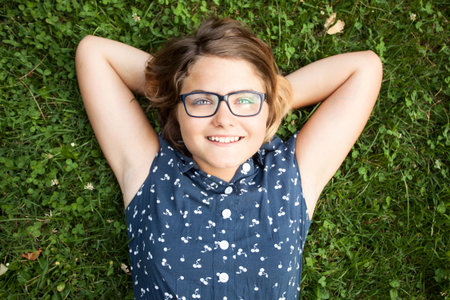 Lovely teen caucasian girl in dress in natureの写真素材