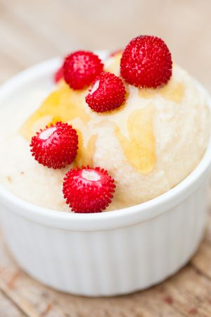 Homemade frozen bananas vegan icecream with forest strawberriesの写真素材