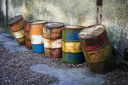 Abandoned rusty barrels with dangerous chemicals insideの写真素材