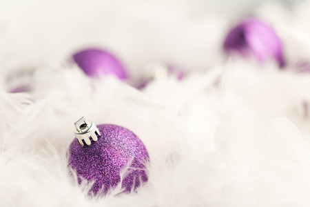 Purple Christmas Baubles in white featherの写真素材